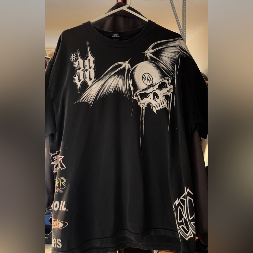 Metal mulisha shirt.  With skull and sponsors on side.